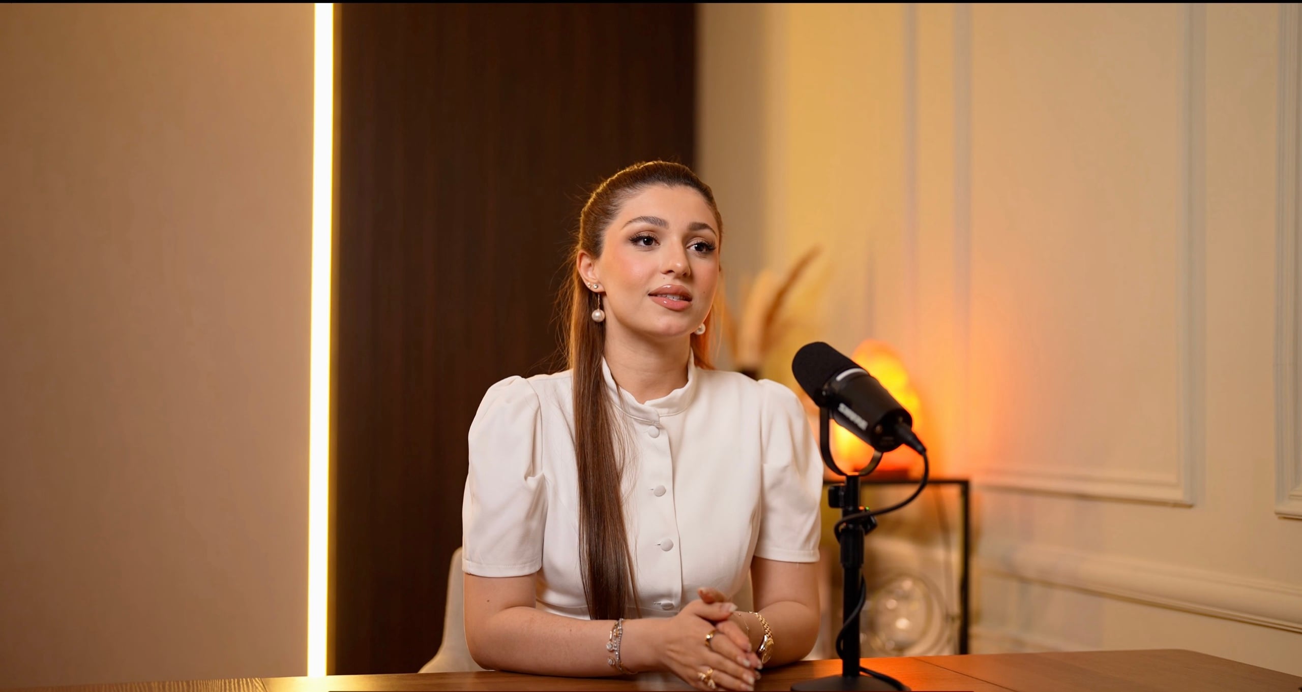 Focused solo podcast desk set with a vertical light strip — Podflix Studio, Business Bay Dubai